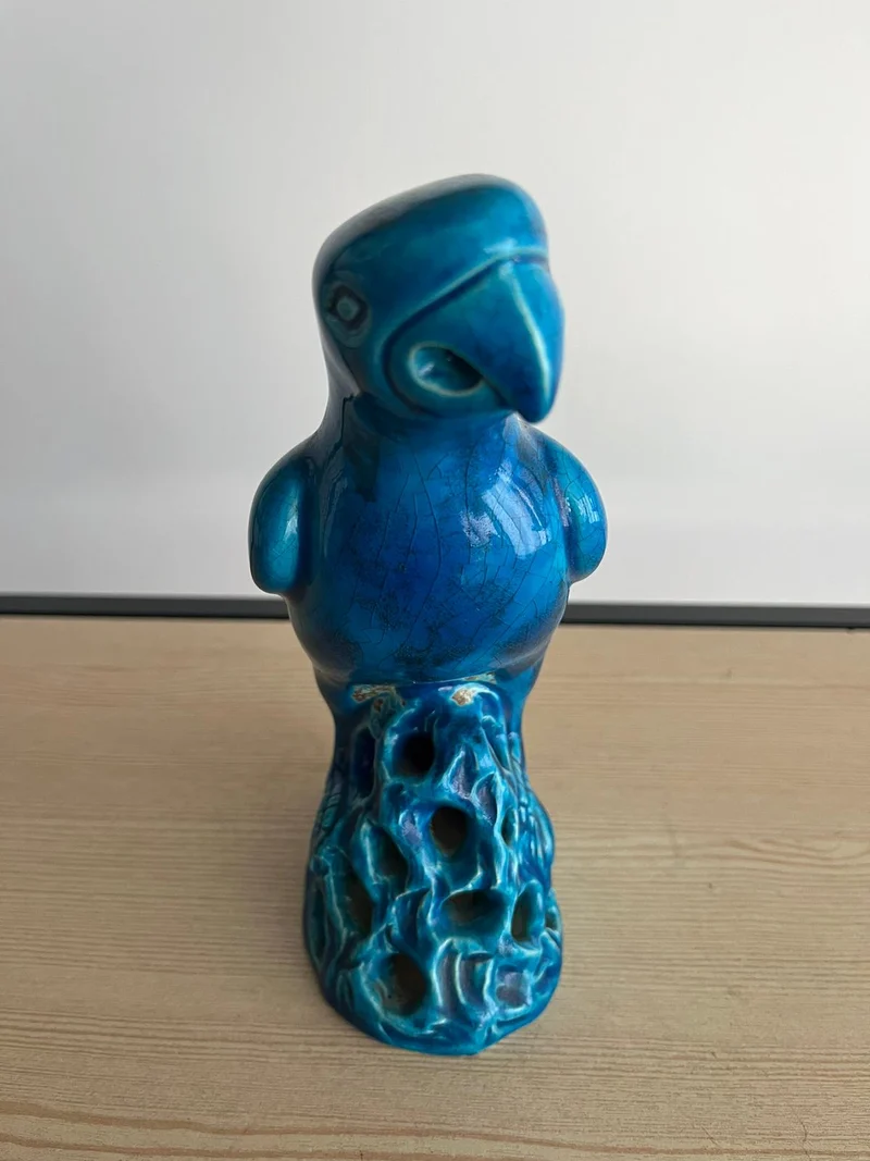 Perroquet ancien en céramique bleu