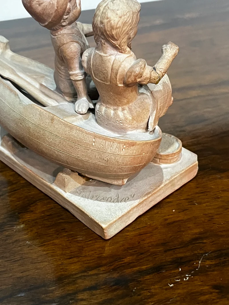 Statuette 2 enfants sur barque signé Ana Alexandre
