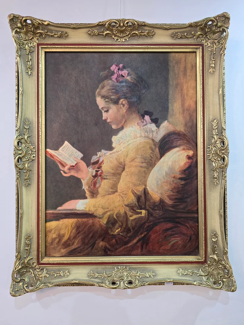 Tableau 'la Liseuse' cadre doré sculpté